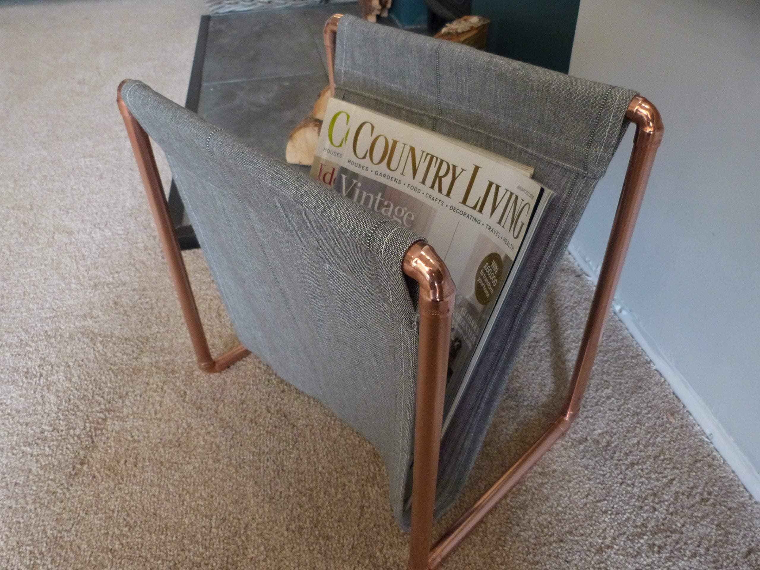 Magazine rack copper designed and created by Artisan Craftworks